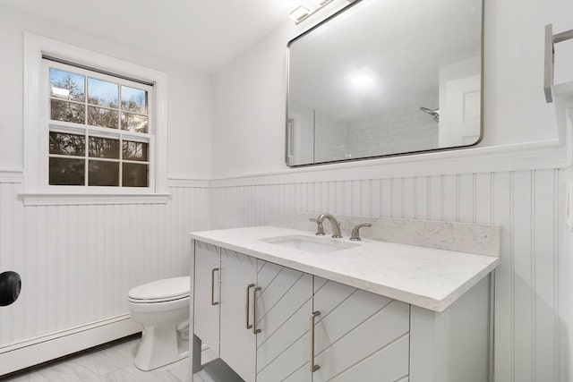 bathroom with vanity, a baseboard radiator, and toilet