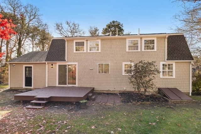 rear view of house featuring a deck