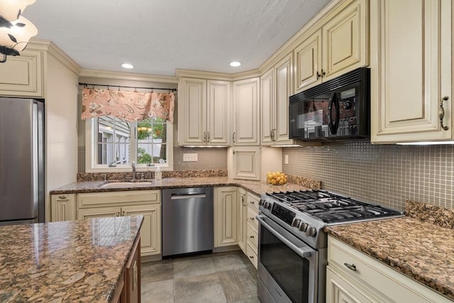100 Avery Heights Dr, Holden, MA 01520 - kitchen featuring cream cabinetry, appliances with stainless steel finishes, decorative backsplash, dark stone counters, and recessed lighting