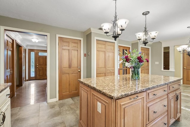 100 Avery Heights Dr, Holden, MA 01520 - kitchen featuring a chandelier, light stone counters, pendant lighting, a center island, and crown molding