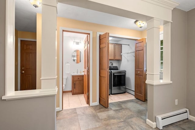 100 Avery Heights Dr, Holden, MA 01520 - hallway with washer / clothes dryer, a baseboard radiator, and ornate columns