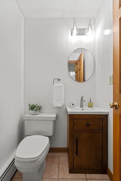 100 Avery Heights Dr, Holden, MA 01520 - half bath featuring a baseboard heating unit, vanity, and tile patterned floors