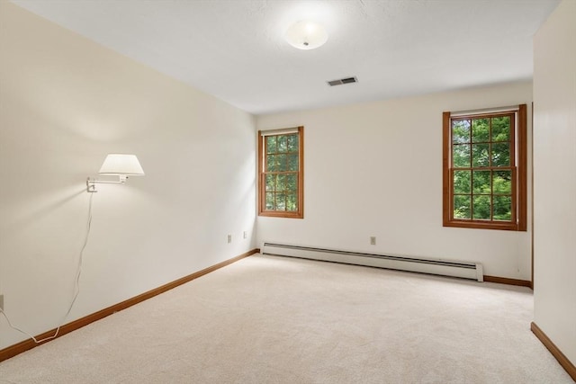 100 Avery Heights Dr, Holden, MA 01520 - carpeted empty room featuring a baseboard heating unit and plenty of natural light