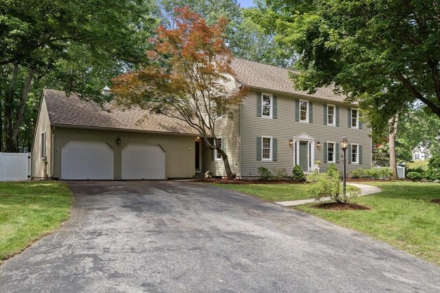 100 Avery Heights Dr, Holden, MA 01520 - colonial inspired home featuring driveway, an attached garage, and roof with shingles
