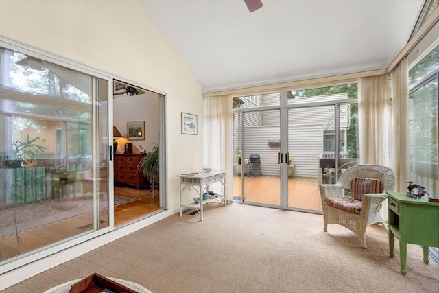 sunroom / solarium with a ceiling fan and lofted ceiling