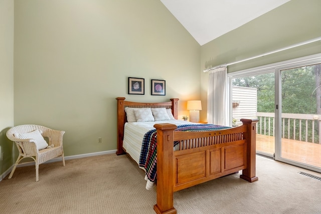 carpeted bedroom with high vaulted ceiling and access to exterior