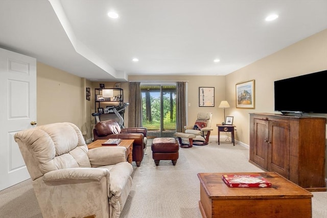 living area with baseboards, light colored carpet, and recessed lighting