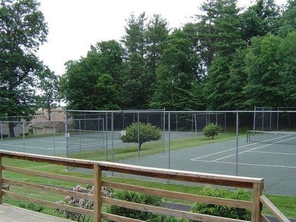 view of sport court featuring fence