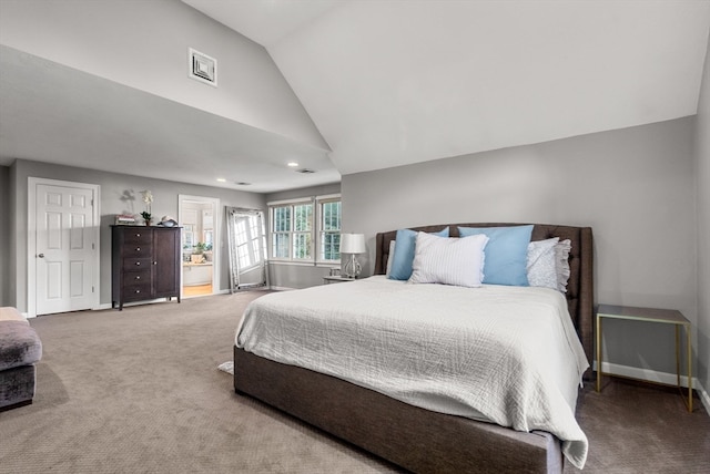 bedroom with vaulted ceiling and carpet