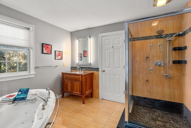 bathroom with vanity and separate shower and tub