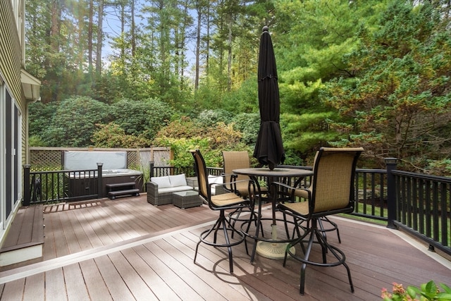 wooden terrace with a hot tub