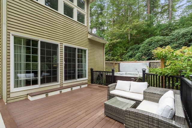 deck with a hot tub and outdoor lounge area