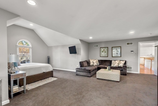 bedroom featuring dark colored carpet and lofted ceiling