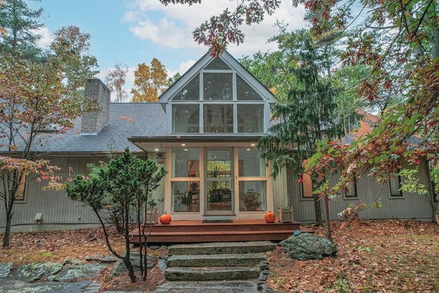 rear view of house with a wooden deck