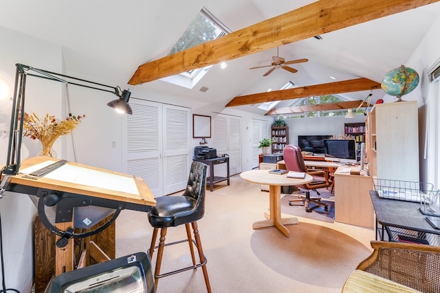 office space with beam ceiling, light colored carpet, a skylight, high vaulted ceiling, and ceiling fan