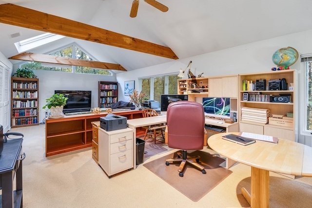 home office with beamed ceiling, light carpet, ceiling fan, high vaulted ceiling, and a skylight