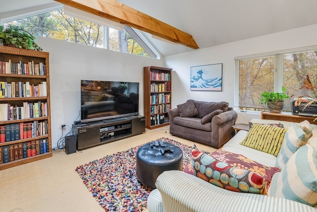 carpeted living room featuring lofted ceiling with beams