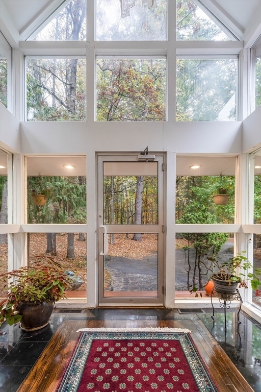 sunroom / solarium with vaulted ceiling and plenty of natural light