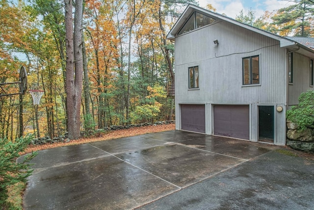 view of side of property featuring a garage