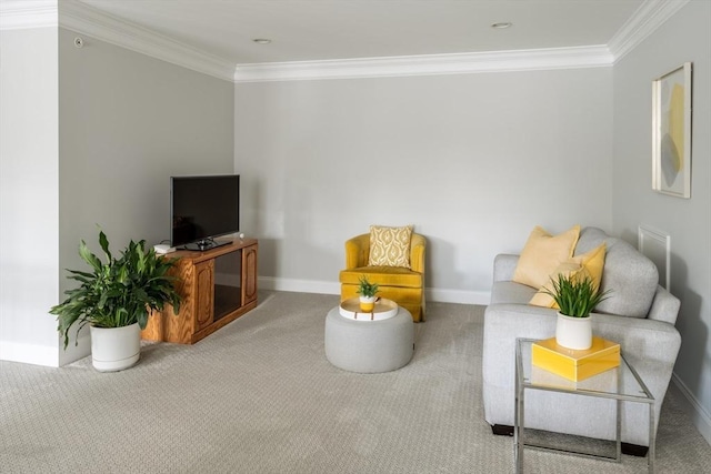 sitting room featuring baseboards, carpet, and crown molding