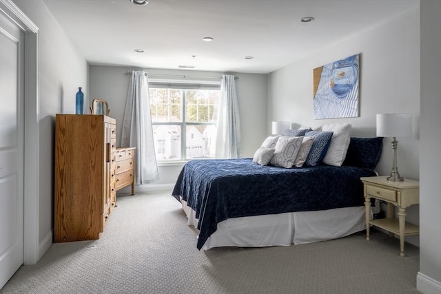 bedroom with light carpet, baseboards, and recessed lighting