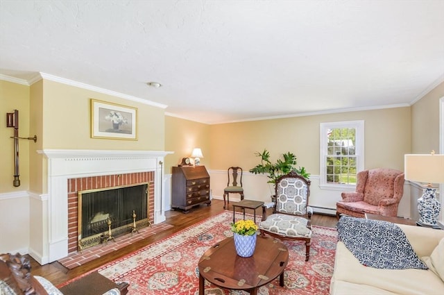 290 Cotuit Bay Dr, Barnstable, MA 02635 - living room with wood finished floors, baseboard heating, crown molding, baseboards, and a fireplace