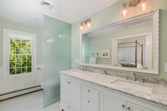 290 Cotuit Bay Dr, Barnstable, MA 02635 - full bathroom with a baseboard heating unit, double vanity, toilet, ensuite bath, and wainscoting