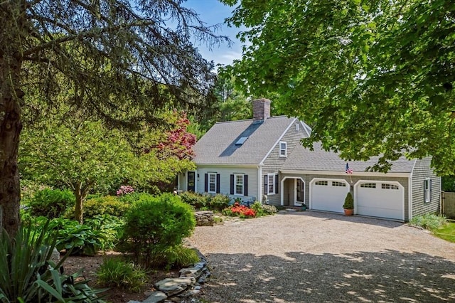 290 Cotuit Bay Dr, Barnstable, MA 02635 - view of front of home featuring a chimney, dirt driveway, a shingled roof, and an attached garage