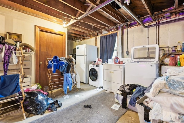 unfinished below grade area with freestanding refrigerator and washer and clothes dryer