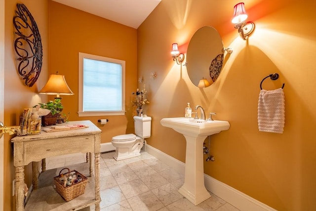 29 Hoveys Pond Dr, Boxford, MA 01921 - half bathroom with marble look tiles and a baseboard radiator