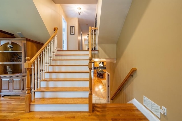29 Hoveys Pond Dr, Boxford, MA 01921 - staircase featuring wood finished floors and baseboards