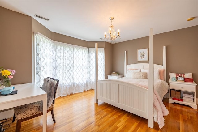 29 Hoveys Pond Dr, Boxford, MA 01921 - bedroom featuring a chandelier and light wood-type flooring