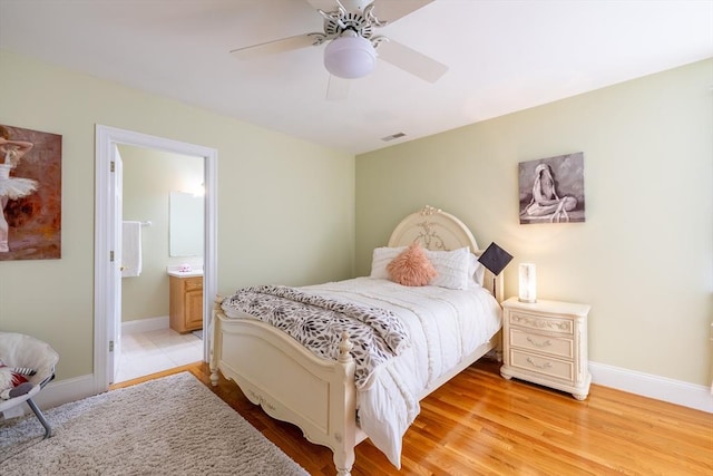 29 Hoveys Pond Dr, Boxford, MA 01921 - bedroom with light wood-style flooring, ensuite bathroom, and ceiling fan