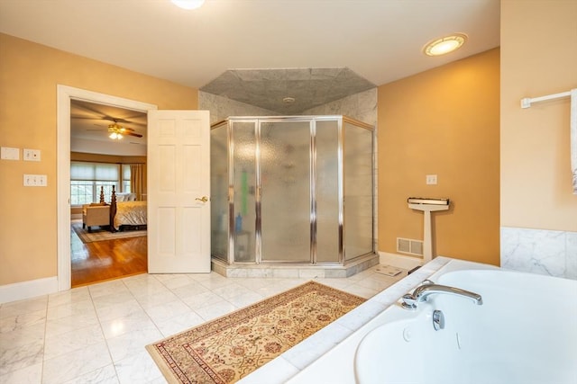 29 Hoveys Pond Dr, Boxford, MA 01921 - ensuite bathroom featuring a garden tub, a shower stall, marble look tile flooring, and ceiling fan