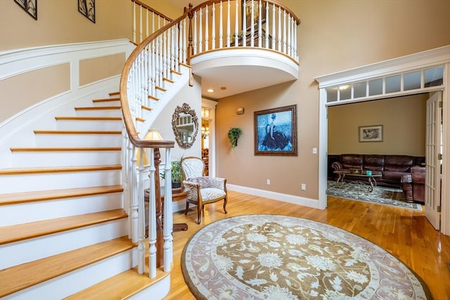 29 Hoveys Pond Dr, Boxford, MA 01921 - entryway with wood finished floors, stairs, and a high ceiling
