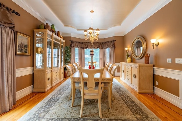29 Hoveys Pond Dr, Boxford, MA 01921 - dining room featuring a chandelier, a raised ceiling, light wood-type flooring, and ornamental molding