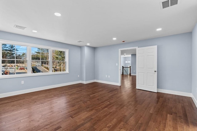 empty room featuring dark wood-type flooring