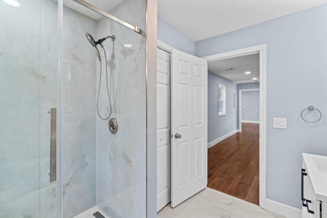 bathroom featuring vanity and an enclosed shower