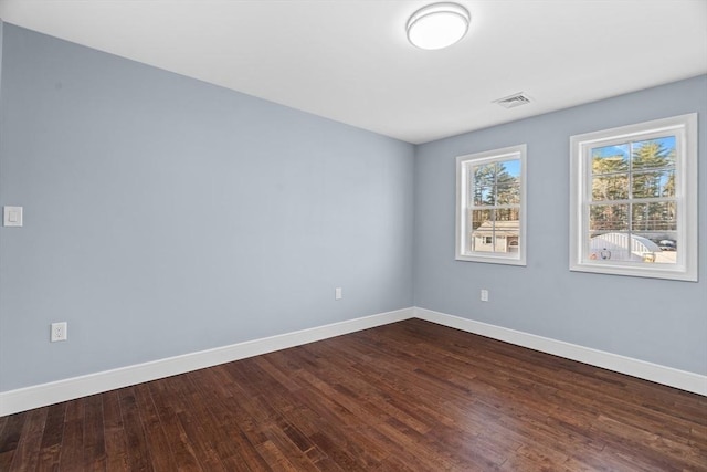 empty room featuring hardwood / wood-style flooring