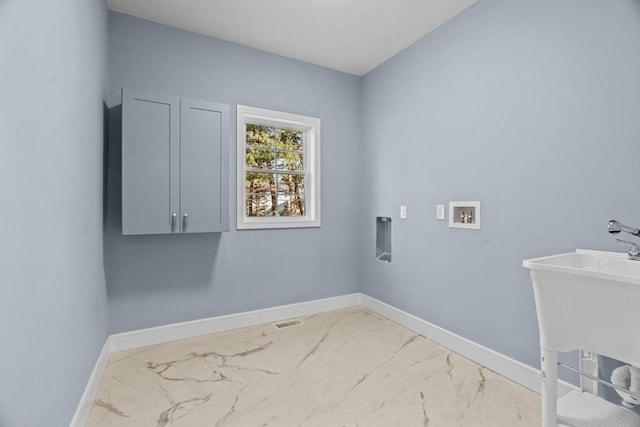 clothes washing area with cabinets, hookup for a washing machine, and electric dryer hookup