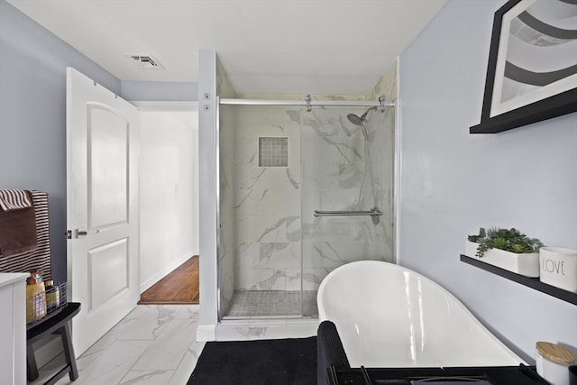 full bath featuring visible vents, a soaking tub, marble finish floor, and a marble finish shower