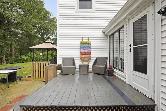 wooden deck featuring a gazebo