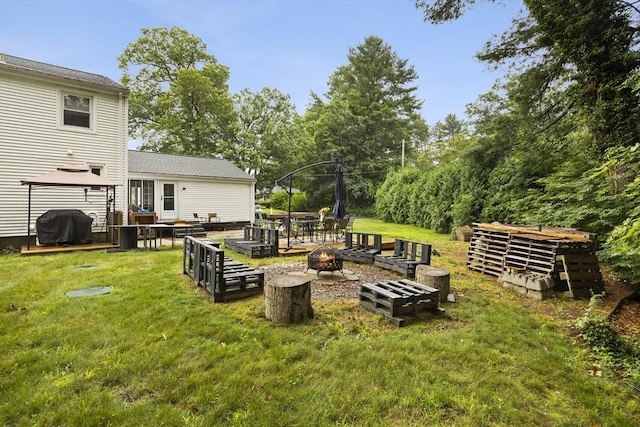 view of yard with a fire pit and a gazebo