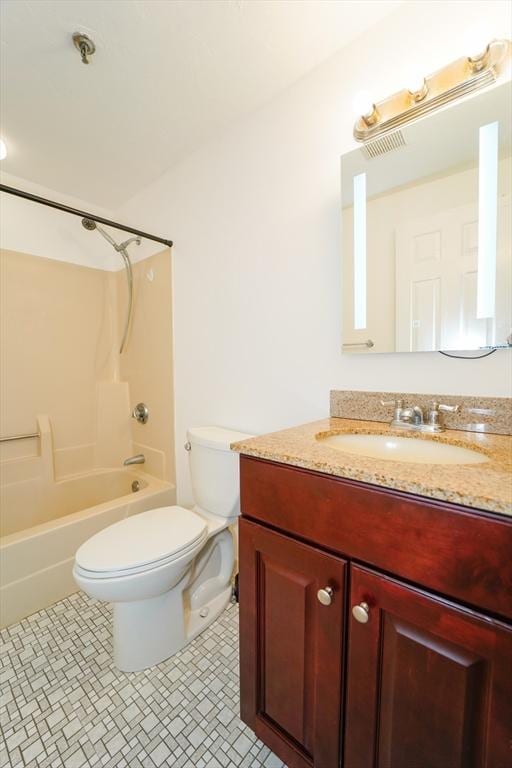 full bathroom with tile patterned flooring, vanity,  shower combination, and toilet