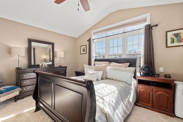 bedroom featuring light colored carpet, a ceiling fan, and lofted ceiling