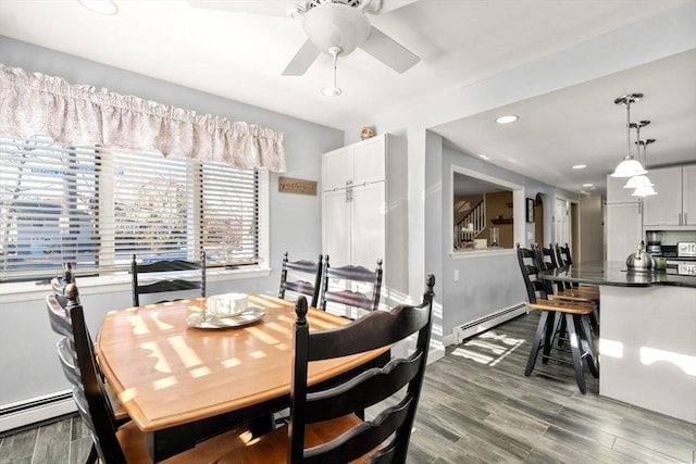 dining room featuring baseboard heating, recessed lighting, dark wood-type flooring, and a ceiling fan