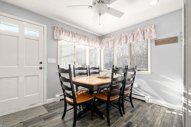 dining space featuring baseboards, dark wood-style flooring, and baseboard heating