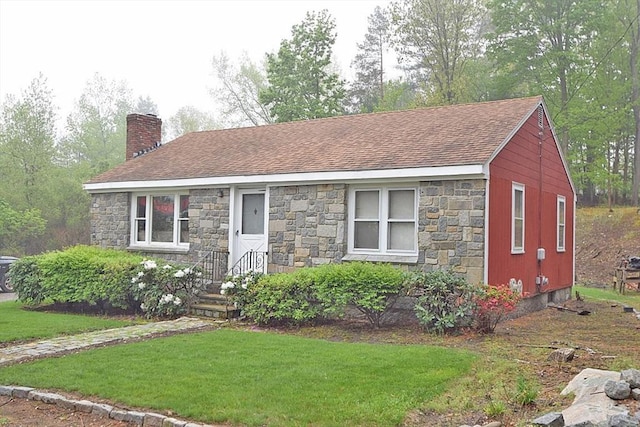 7 Lincoln Ave, Randolph, MA 02368 - ranch-style house with a chimney, stone siding, roof with shingles, and a front lawn