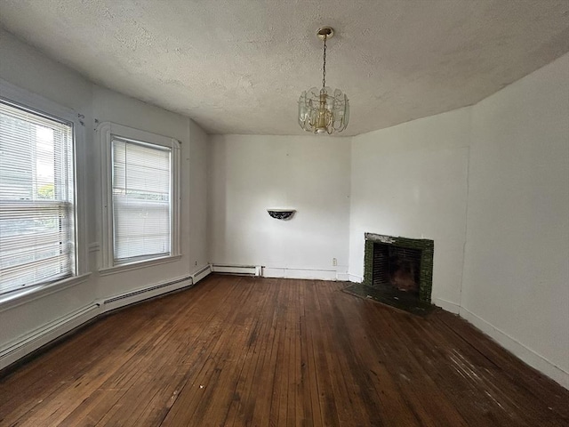 31 Rosedale St, Boston, MA 02124 - unfurnished living room featuring dark wood finished floors, a chandelier, a textured ceiling, a fireplace, and baseboards