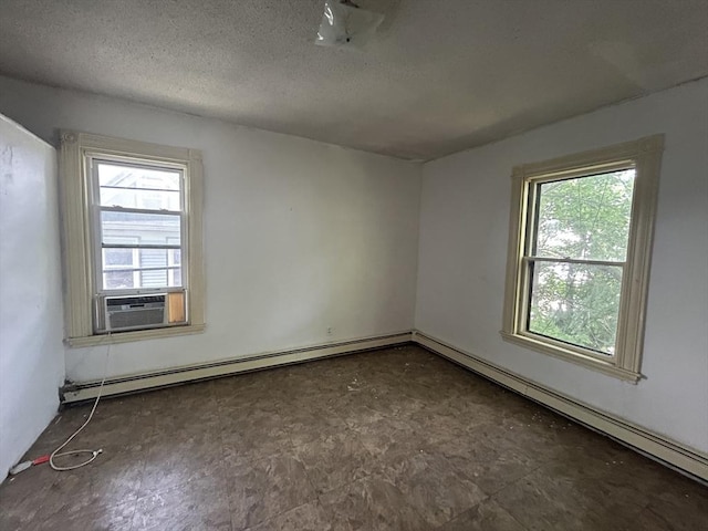 31 Rosedale St, Boston, MA 02124 - spare room with plenty of natural light, a baseboard radiator, a textured ceiling, and cooling unit